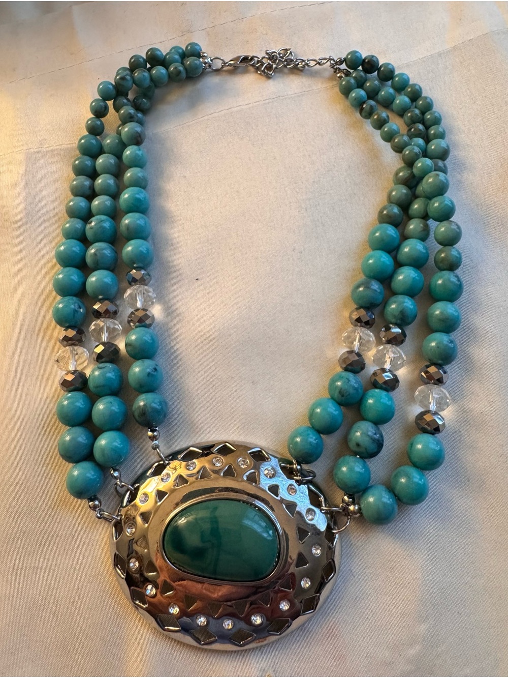 Turquoise beaded multi strand necklace with oversized pendant